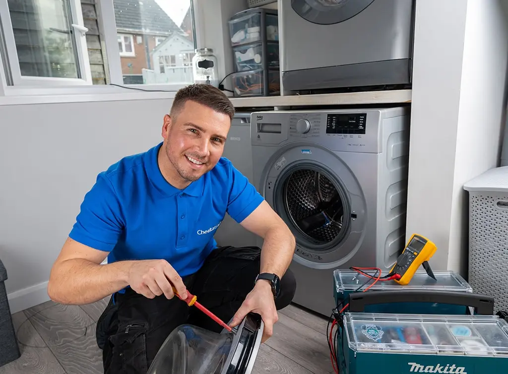 technician repairing washing machine appliance repairs dunstable service